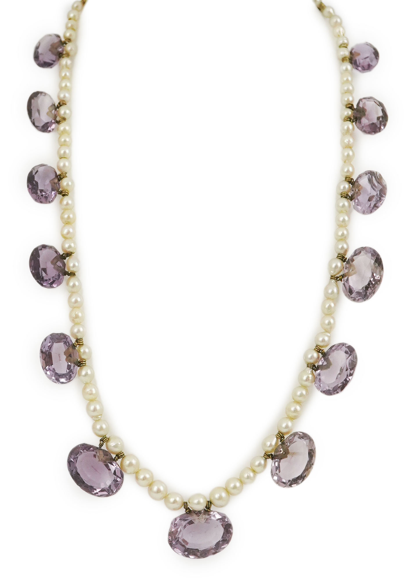 A 19th century pearl and graduated fifteen stone oval cut amethyst set drop necklace, with a gold barrel shaped clasp